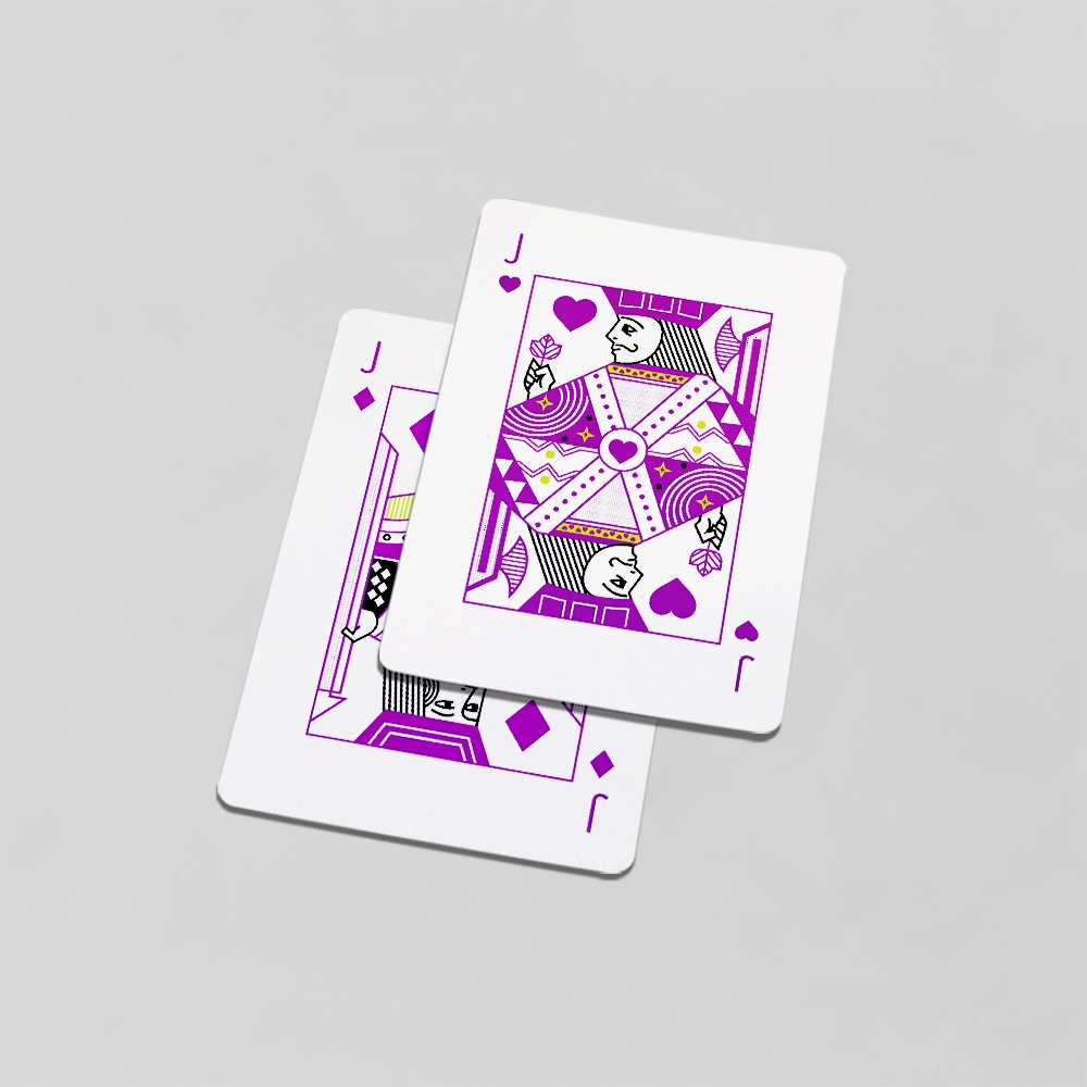 A jack of hearts lies on top of a jack of diamonds.